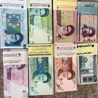 تعدادی بسته اسکناس جمهوری اسلامی با شماره های سری