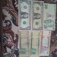 تعدادی اسکناس قدیمی دلار آمریکا ، افغانی و لیر ترکیه